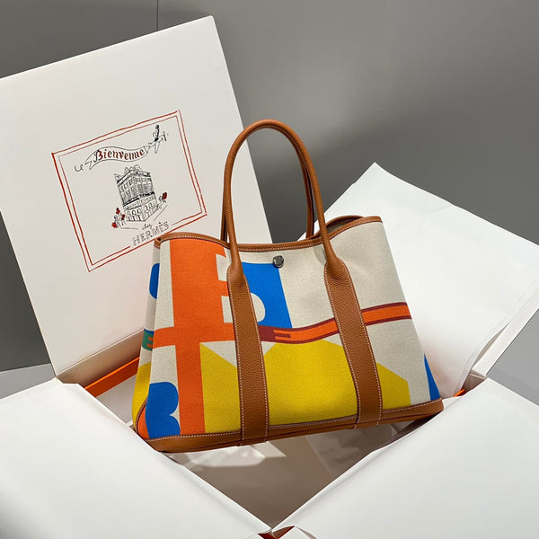 HERMES GARDEN PARTY 36 IN VIBRANT TOILE H CANVAS GOLD CALFSKIN Royal tushar