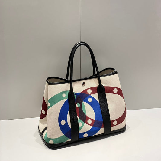 HERMES GARDEN PARTY 36 IN MULTICOLOR TOILE H CANVAS BLACK CALFSKIN OVERLAPPING POLKA RINGS PRINT Royal tushar